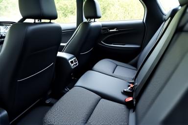 Pristine interior of a car, showing freshly vacuumed seats and carpets with clear lines.